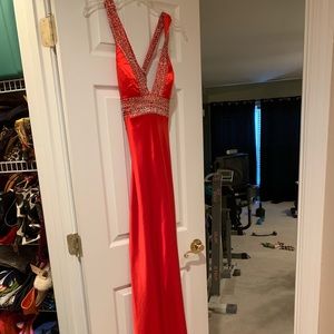 Red prom dress with beads and cut outs